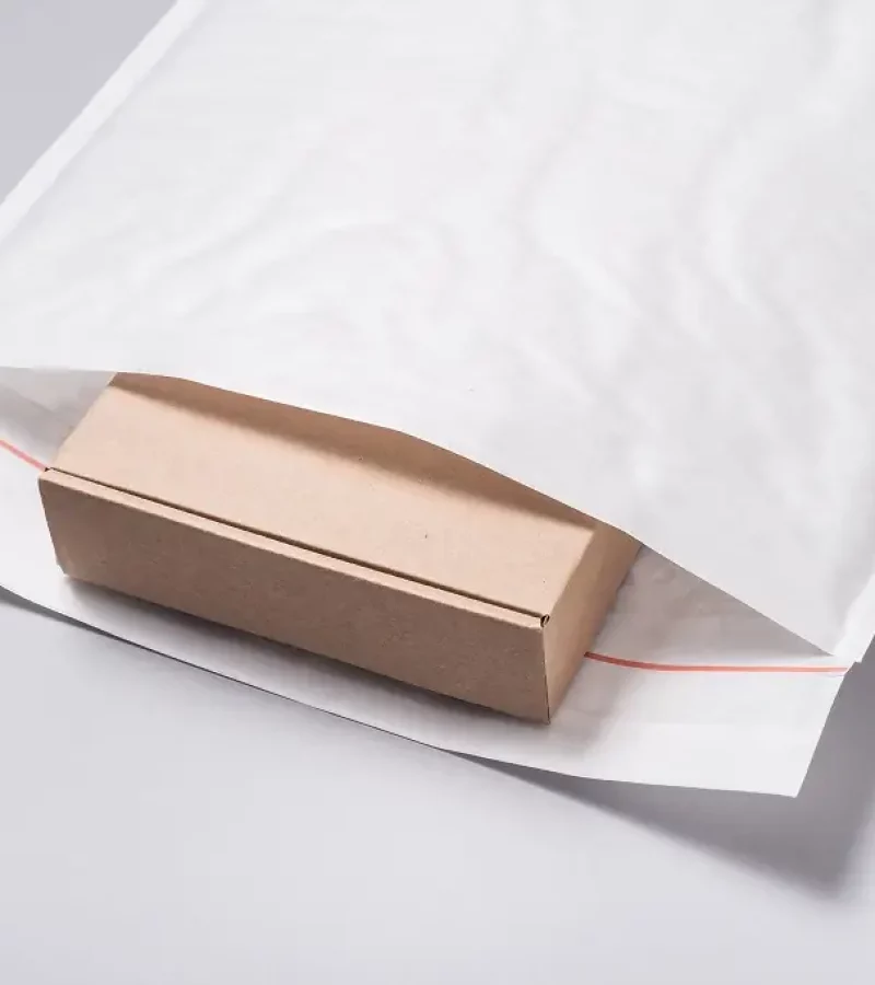 unmarked box inside a white bubble package that's unlabeled